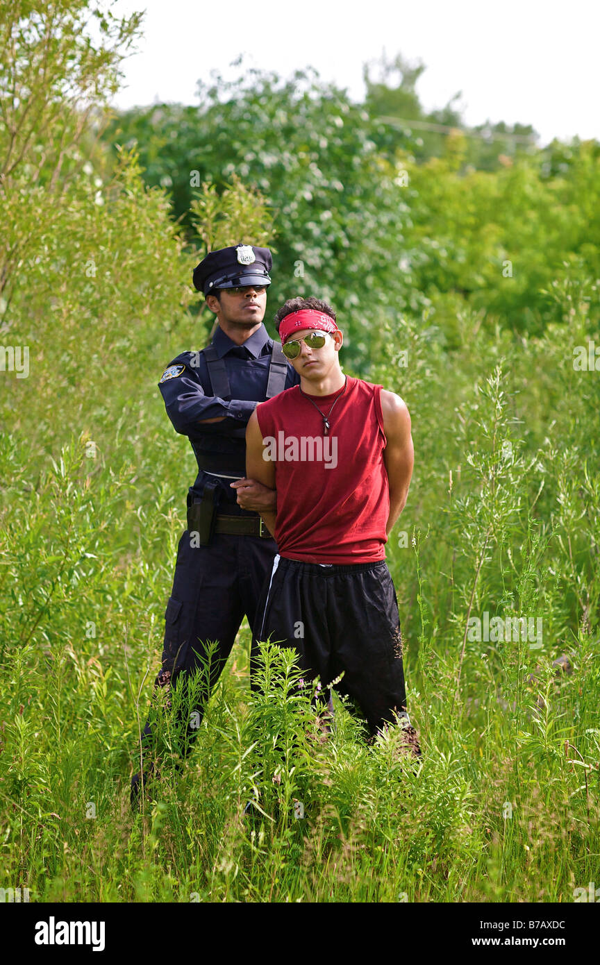 Police Officer Arresting Suspect Stock Photo