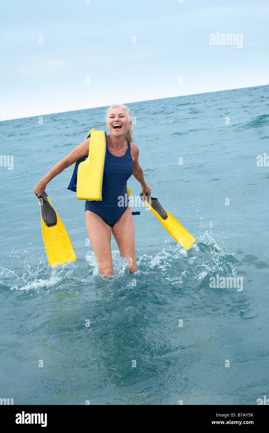 Woman Walking out of Water Stock Photo