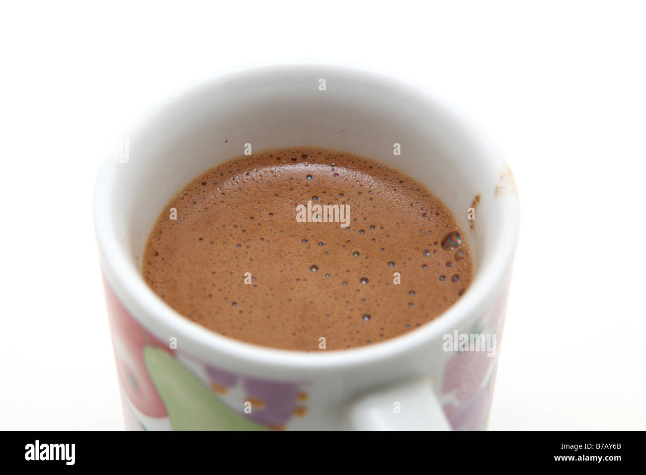 mug with greek coffee detail with bubbles on white background Stock