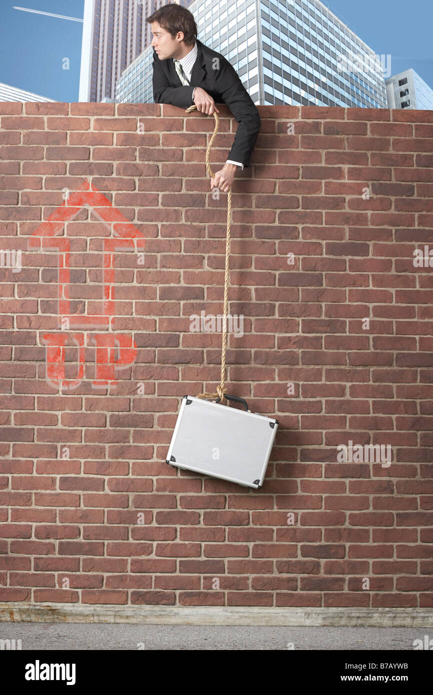 Businessman pulling collar up hires stock photography and images Alamy