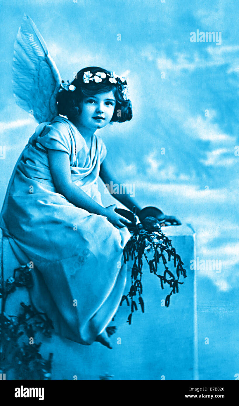 blue vintage photo cute angel girl with flowers Stock Photo