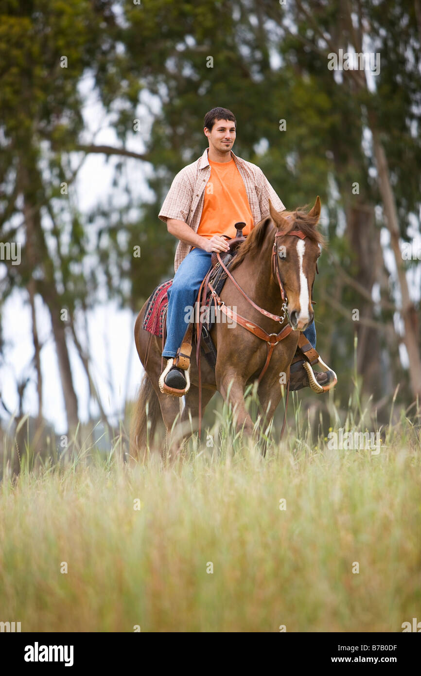 Man Horseback Riding on Ranch, Santa Cruz, California, USA Stock Photo