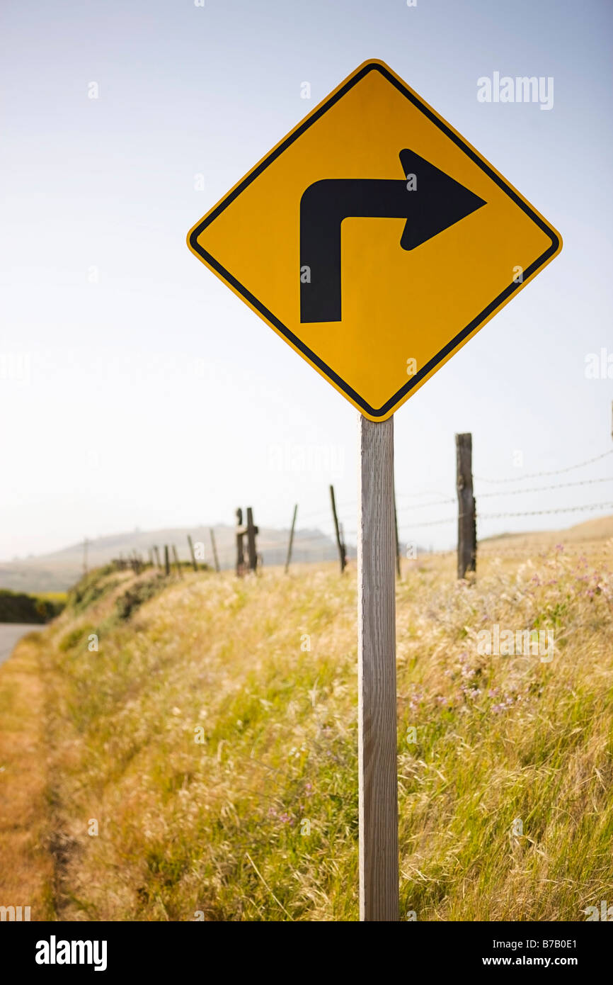 Sharp Curve Ahead Sign on Rural Highway, Santa Cruz, California, USA Stock Photo