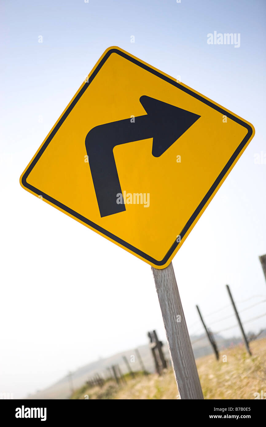 Sharp Curve Ahead Sign on Rural Highway, Santa Cruz, California, USA Stock Photo