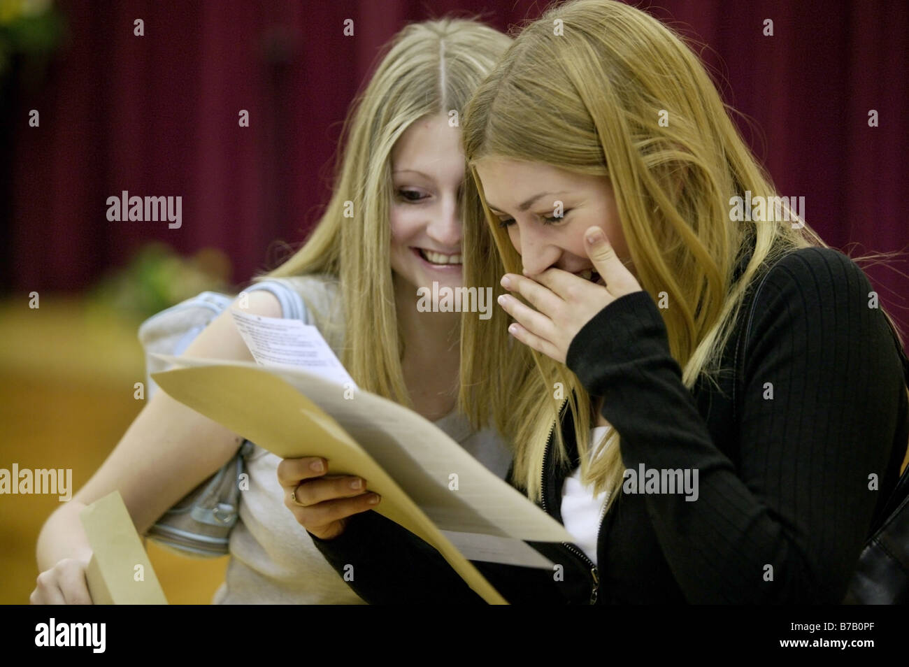 Two girls find out their GCSE exam results in a school in Shropshire, UK Stock Photo