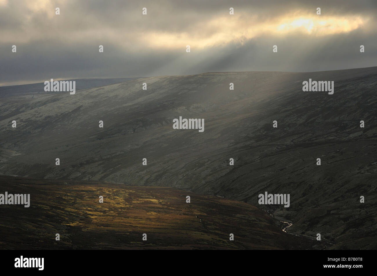 Shafts of light over Thack Moor from Croglin fell North Pennines England Stock Photo