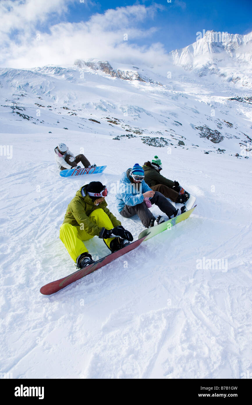 Snowboarders on piste at Saas Fee Switzerland Stock Photo