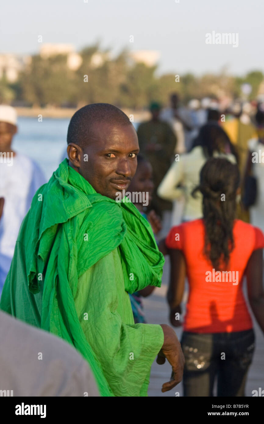 Muslim man on the Faidherbe Bridge in St Louis in Senegal West Africa Stock Photo