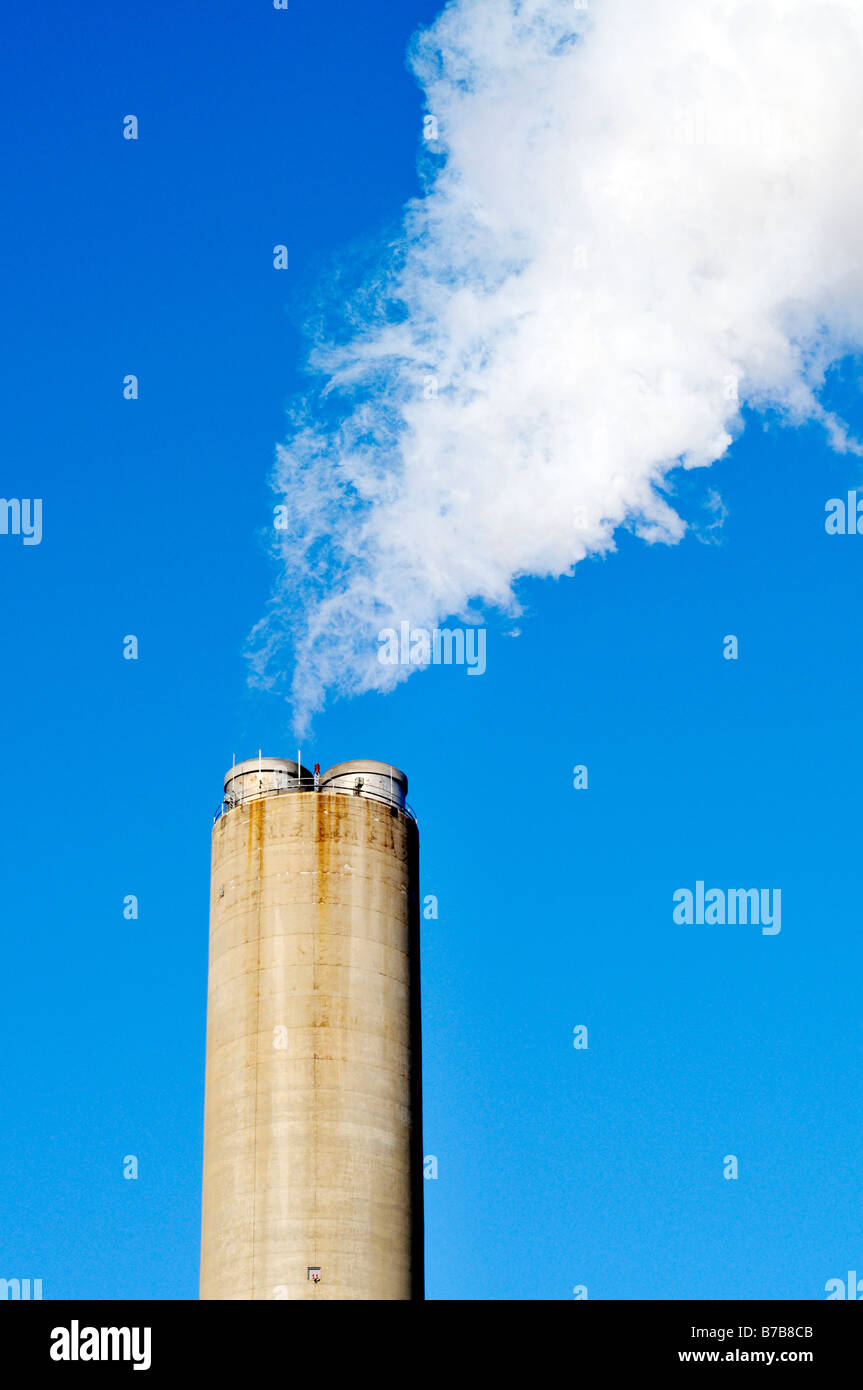 Exhaust from smokestack at power plant Stock Photo