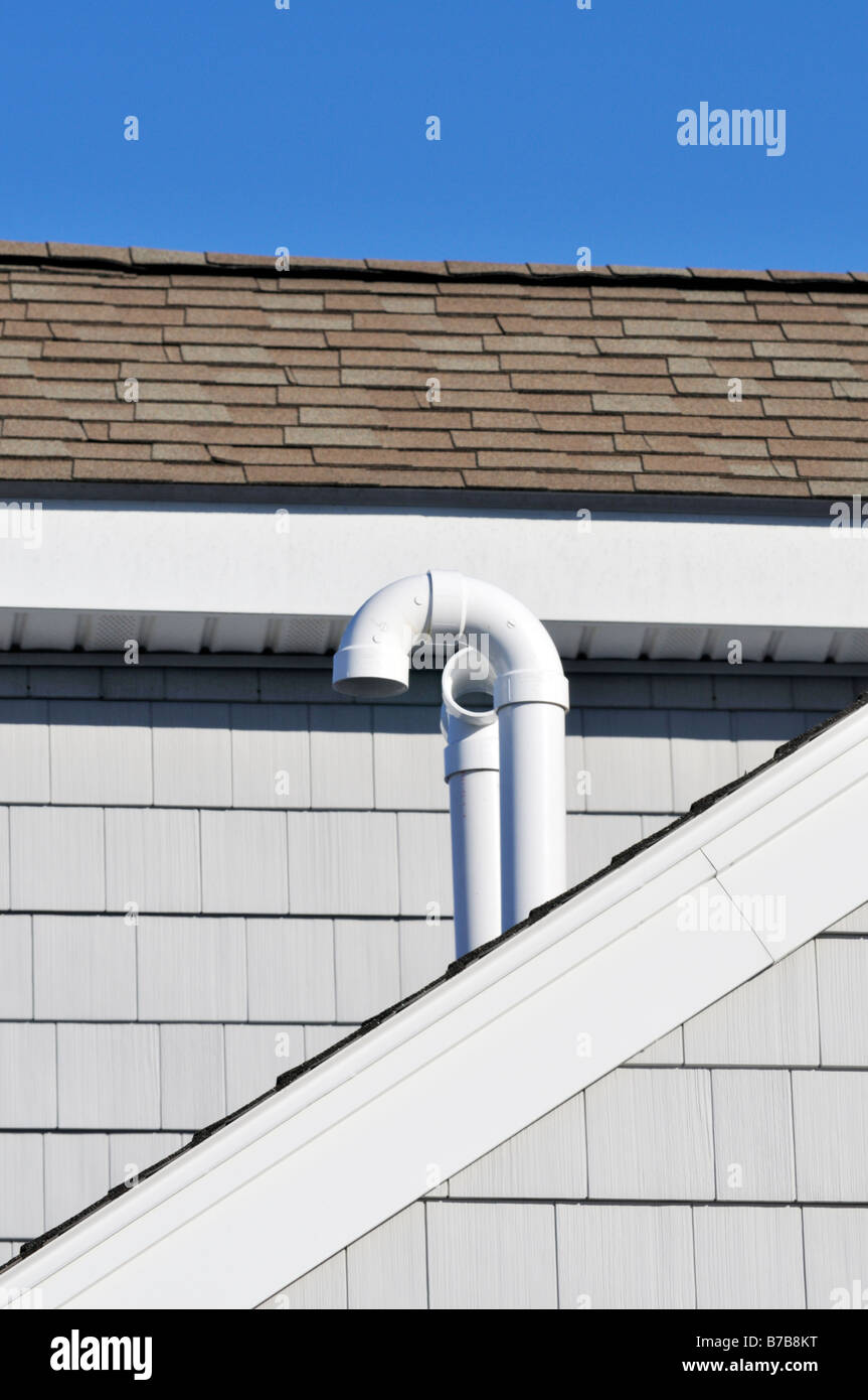 Plastic PVC vent pipes on roof Stock Photo