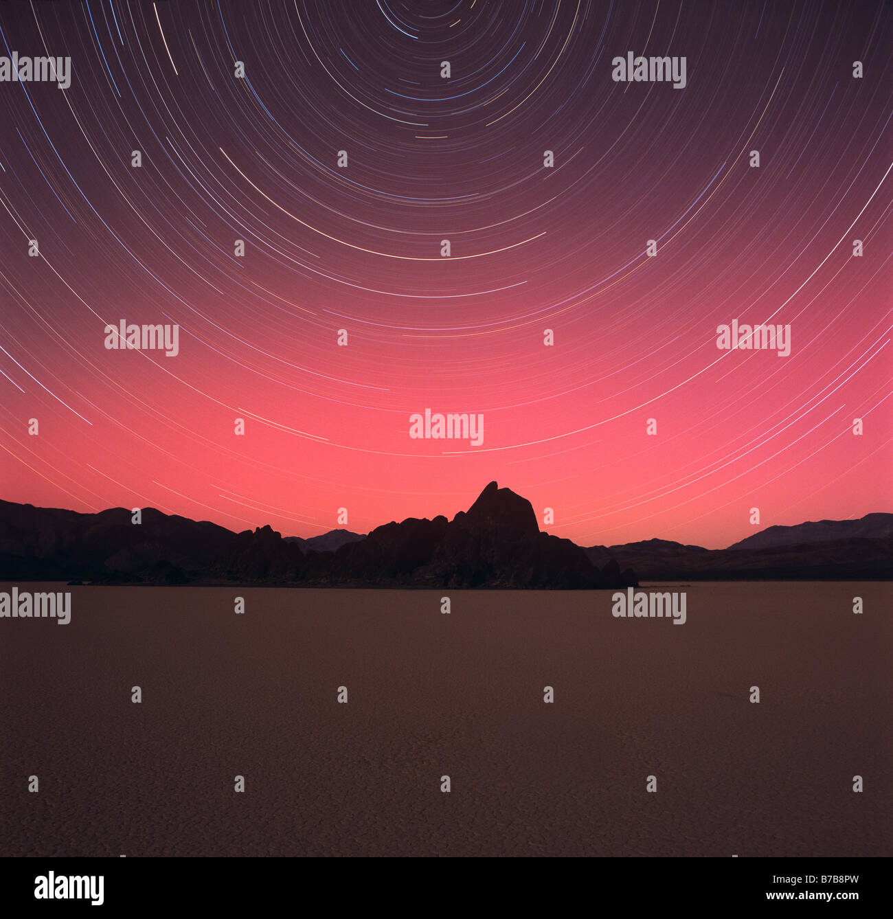 NIGHT SKY turning around NORTH STAR above DEATH VALLEY CALIFORNIA Stock Photo