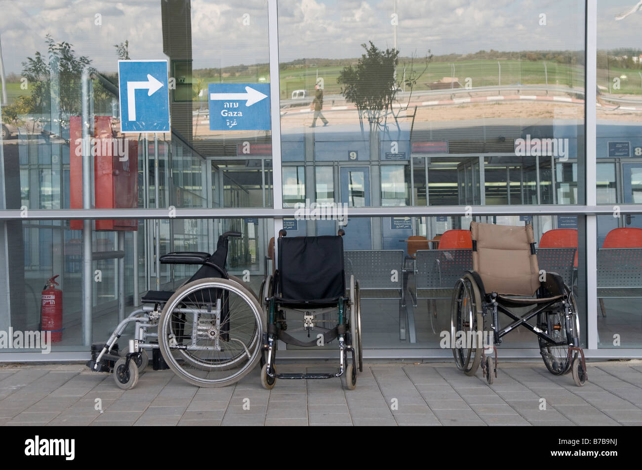 Empty wheel chairs lined at the entrance to the closed Erez crossing terminal into Gaza on 18 January 2009. Stock Photo