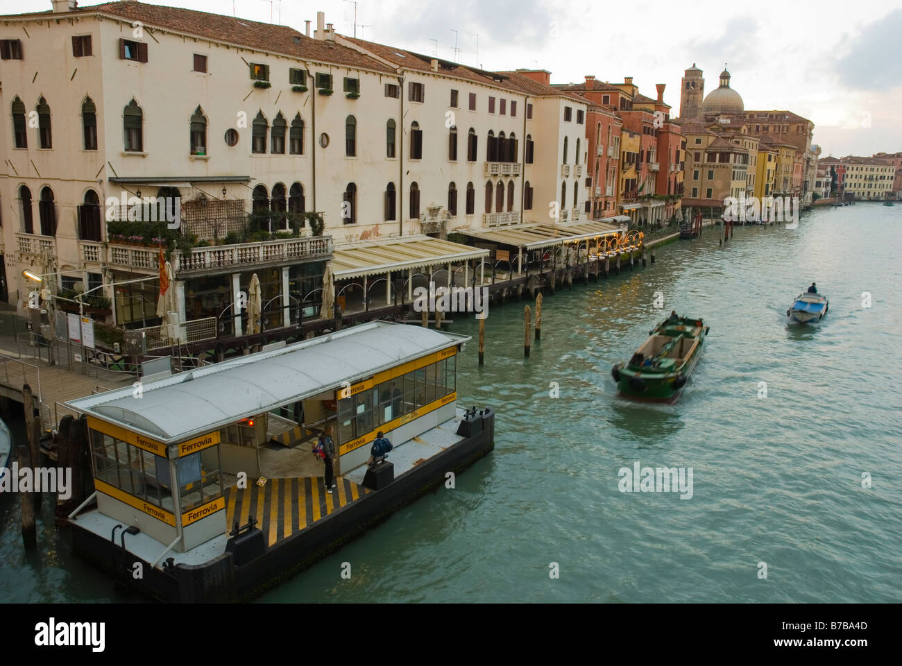 Traffic on Canal Grande at Ferrovia vaporetto stop in Venice Italy Europe Stock Photo