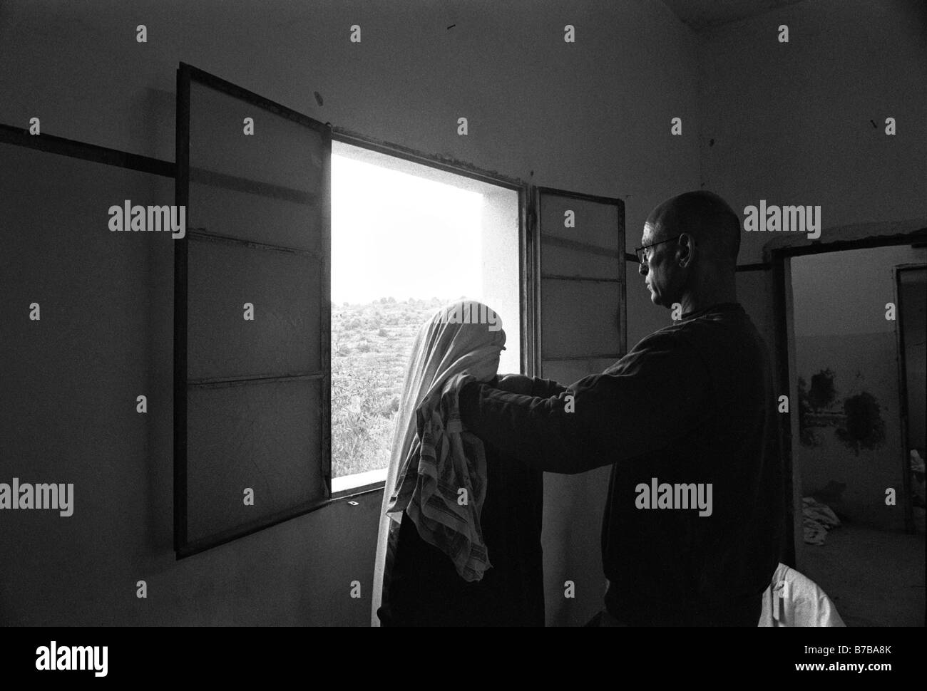 Dr. Yigal Shochat from the PHR Physicians for Human Rights checking a Palestinian woman during a mobile clinic visit in the West Bank Israel Stock Photo