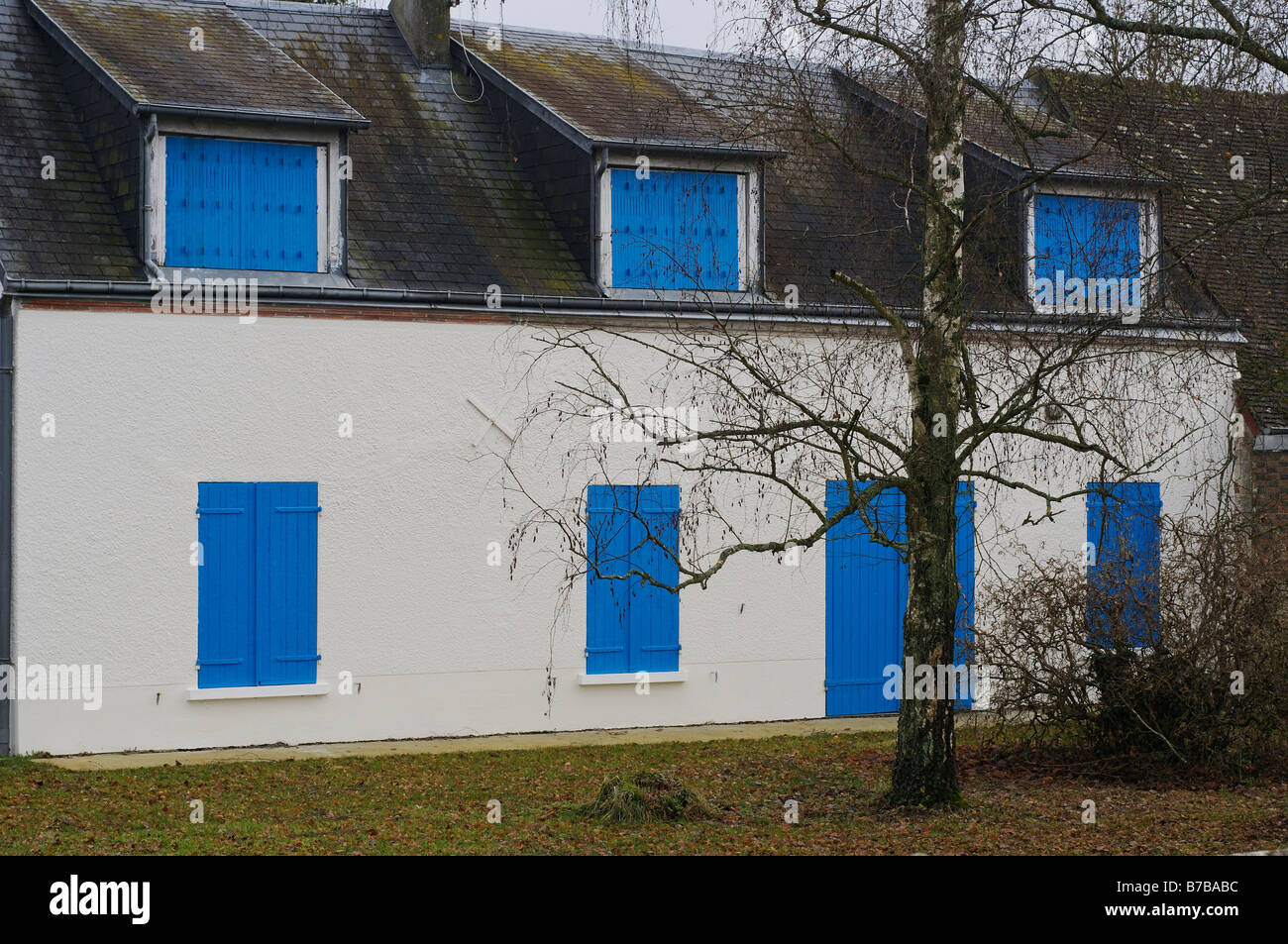 Locked up house with window shutters shut France near Orleans Stock Photo