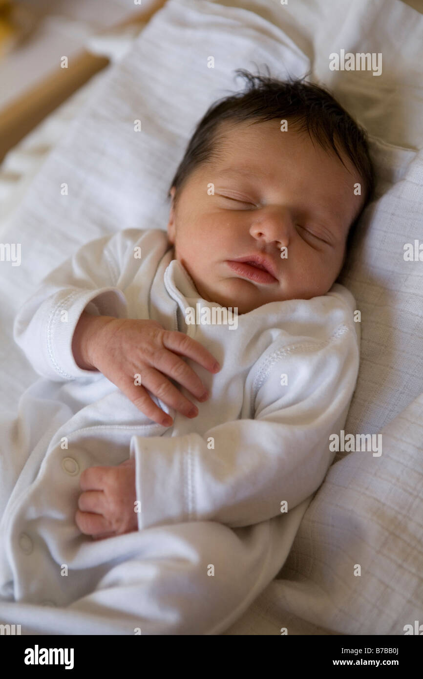 baby girl sleeping in her cot Stock Photo Alamy