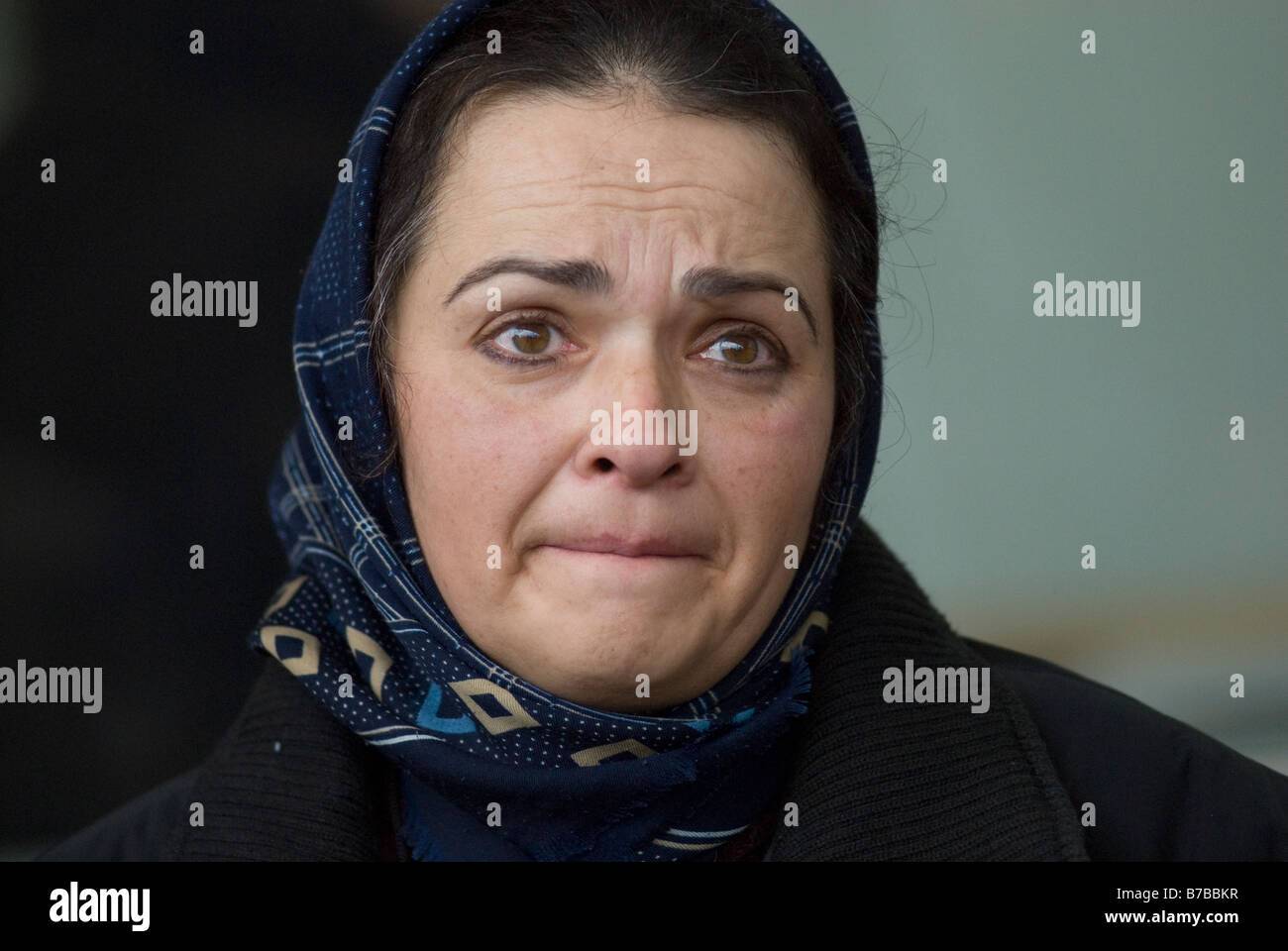 A Palestinian woman resident of Gaza Strip looks worried soon after entering Israel at the Erez border crossing with Israel on January 02 2009 Stock Photo
