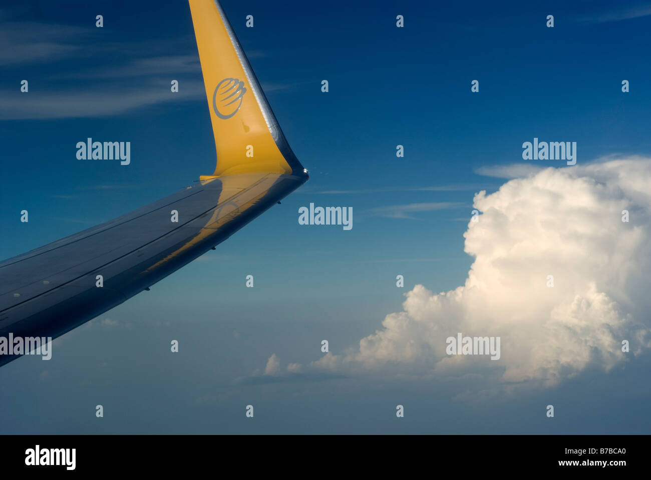 Modern aircraft wing and clouds over Europe Stock Photo