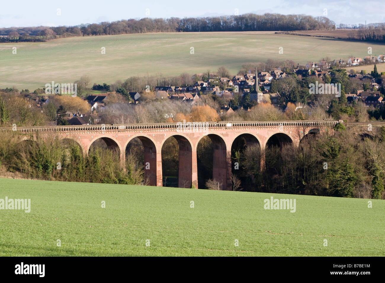 Railway viaduct across Darent valley at Eynsford Kent UK with village