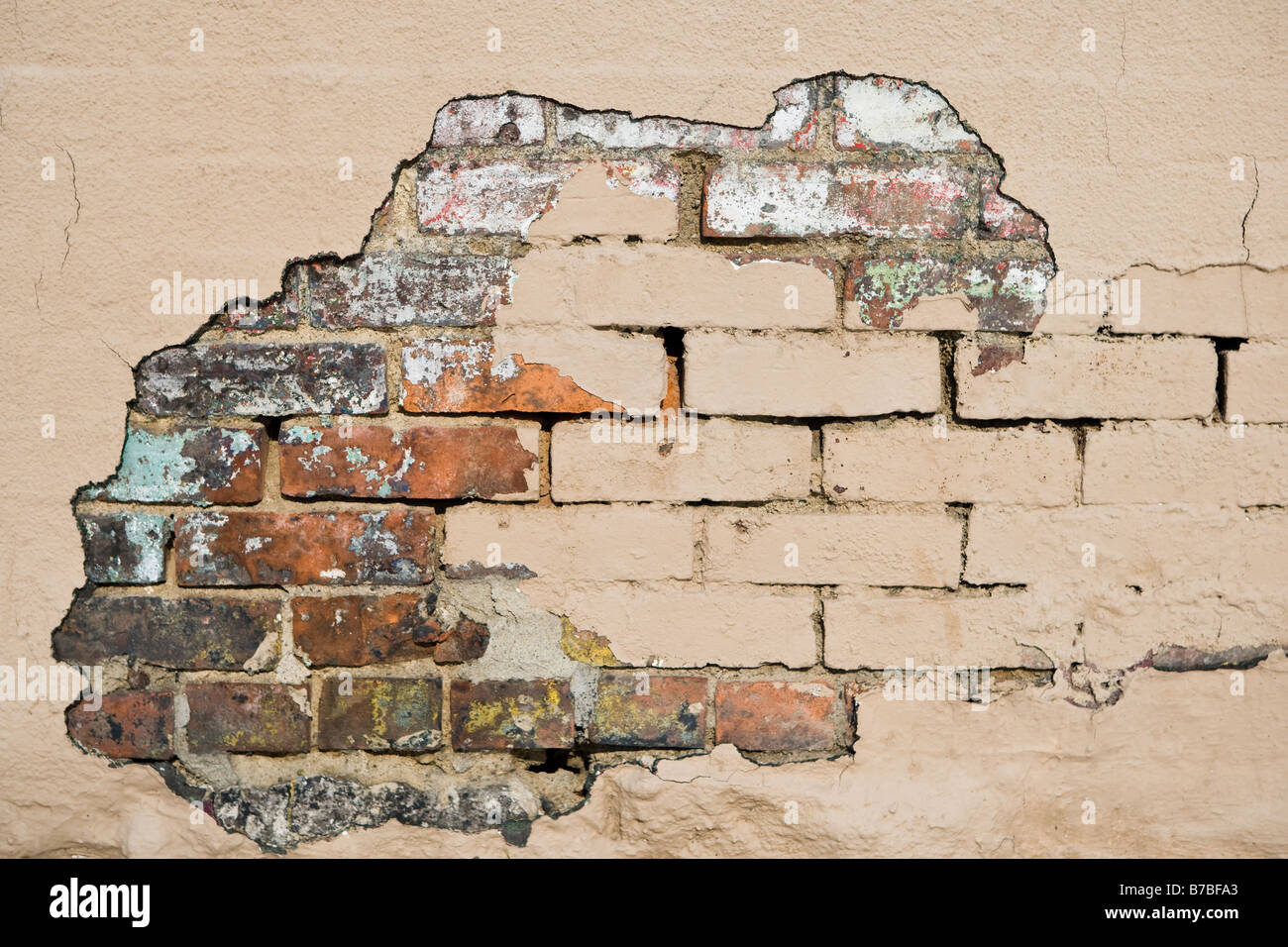 A brick deteriorating brick wall Stock Photo