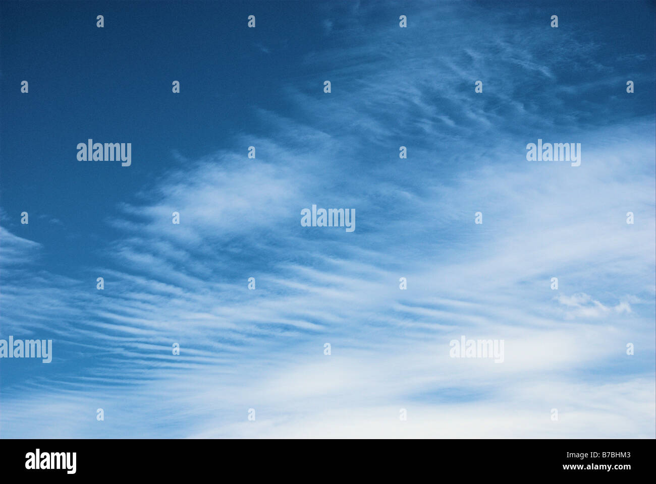 Soft white cloud pattern against a bright blue sky Stock Photo