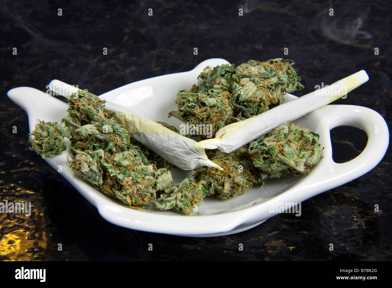 Marijuana Cigarette smoking in fancy dish, Studio Shot Stock Photo
