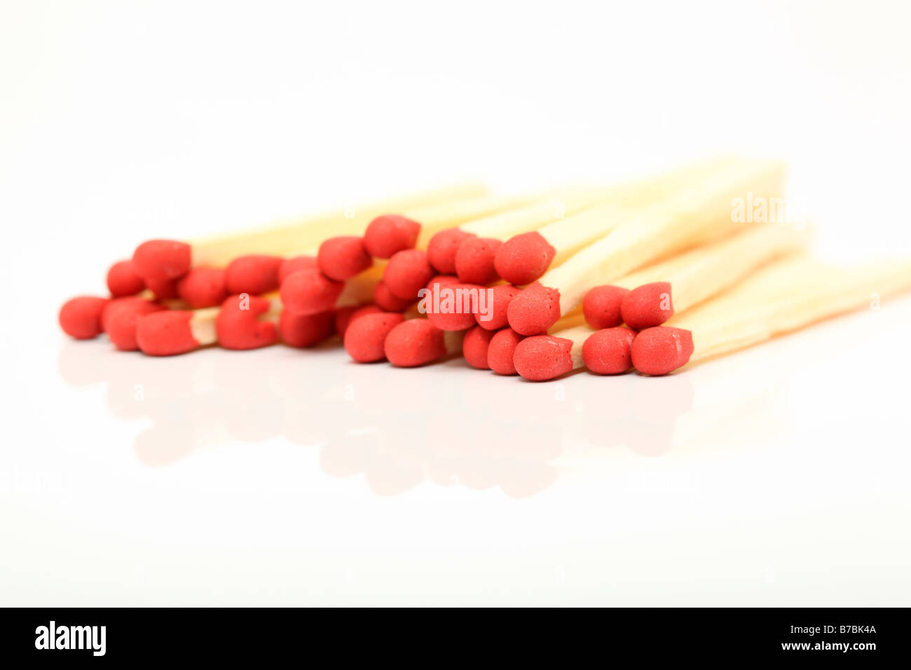 stack of wooden matches sticks closeup detail with reflection isolated Stock Photo