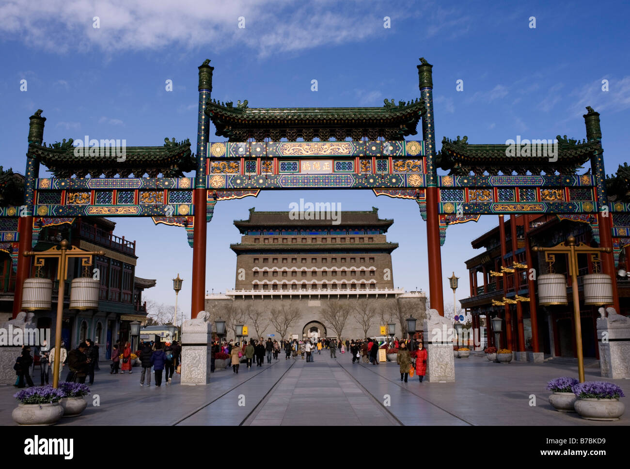 Ornate traditional Chinese gate with Zhengyangmen gate to rear at newly rebuilt Qianmen Street in Beijing 2009 Stock Photo