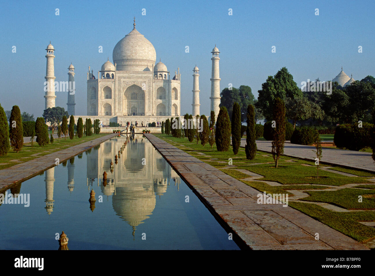 The TAJ MAHAL built by emperor Shahjahan for his wife in 1653 REFLECTS in a POOL AGRA INDIA Stock Photo