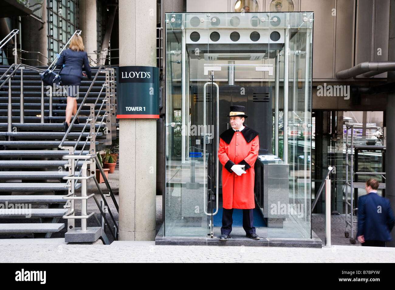 Doorman in red coat Lloyds building London England Stock Photo