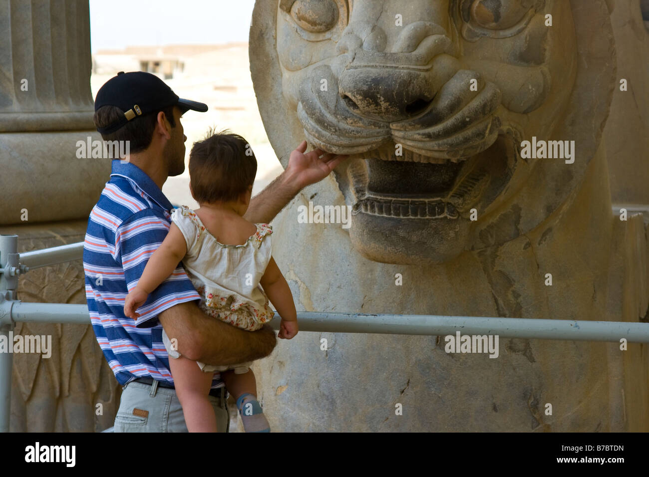 Iranian Father and Daughter at the Ruins of Persepolis in Iran Stock Photo