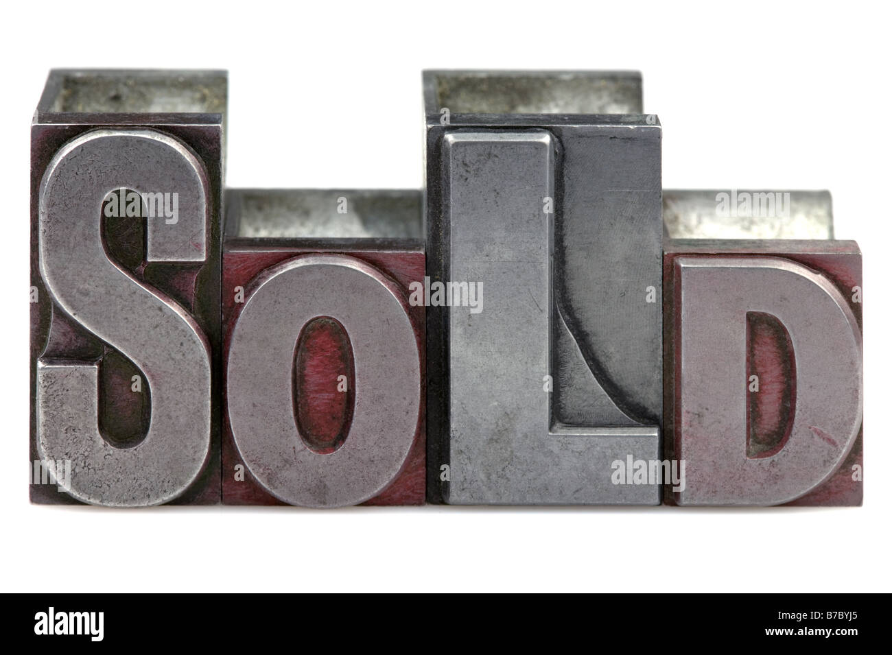 The word Sold in old letterpress printing blocks isolated on a white background Stock Photo