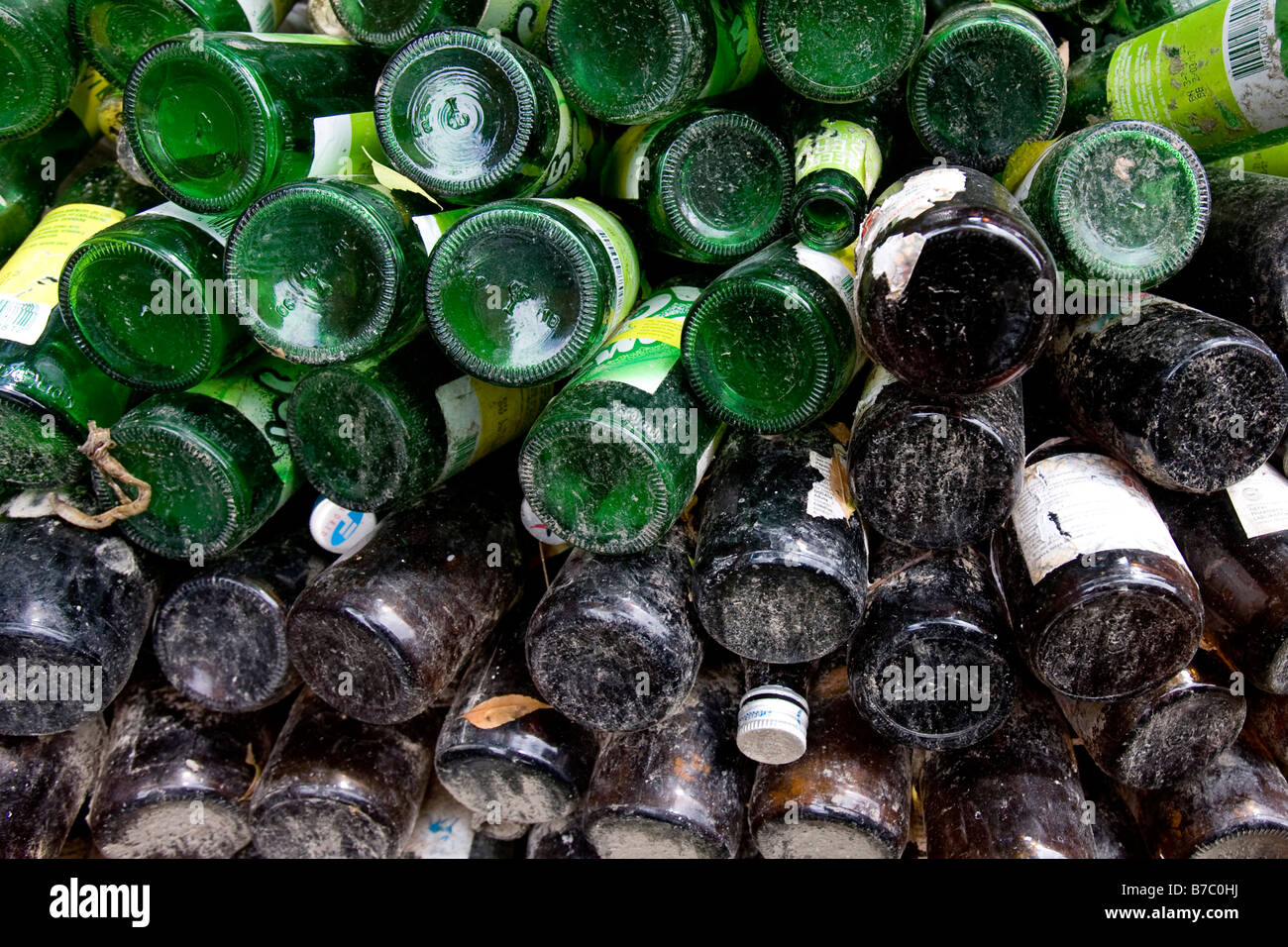Glass bottles stacked in a corner outside of the JAFON youth shelter