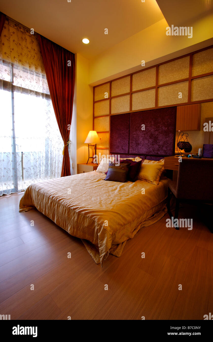 Modern bedroom with a French window curtains pulled apart Stock Photo Alamy