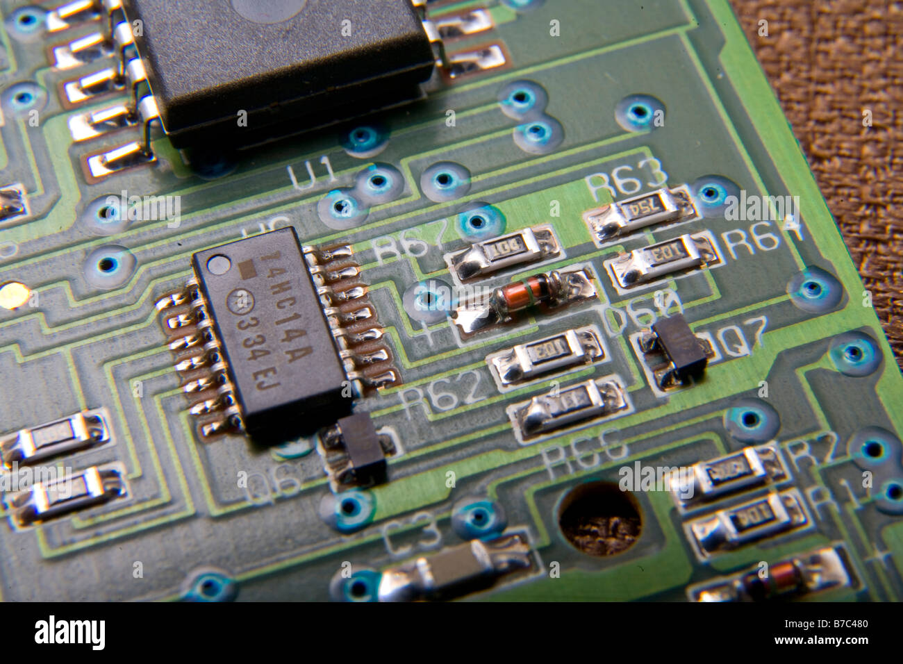 Electronic printed circuit board with computer chips, resistors, capacitors, other parts Stock