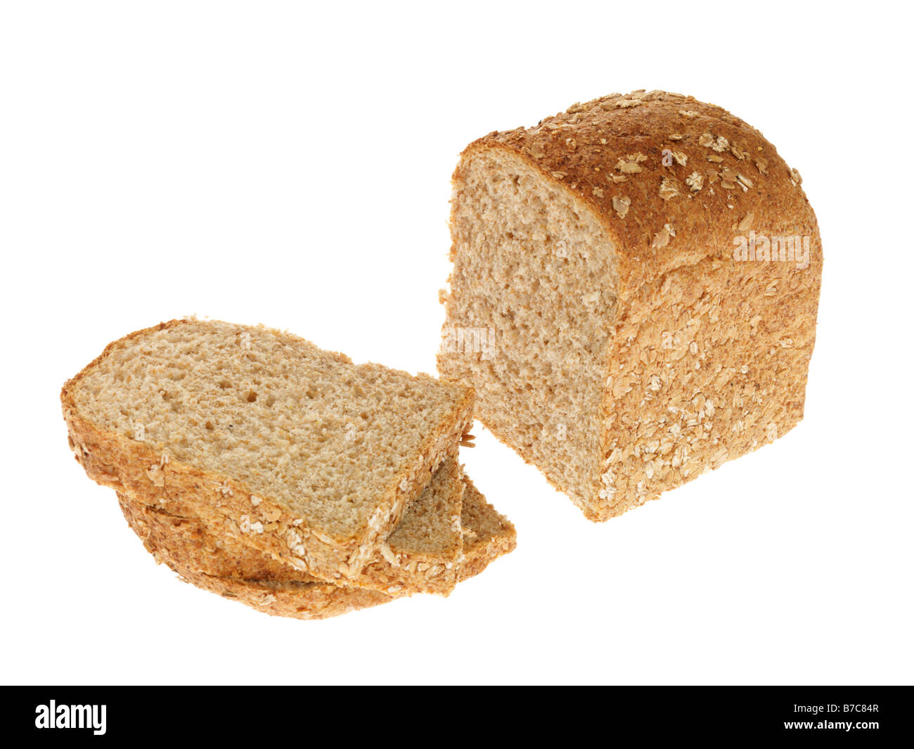 Loaf Of Brown Wholegrain Organic Bread Against A White Background With No People With Copy Space and a Clipping Path Stock Photo