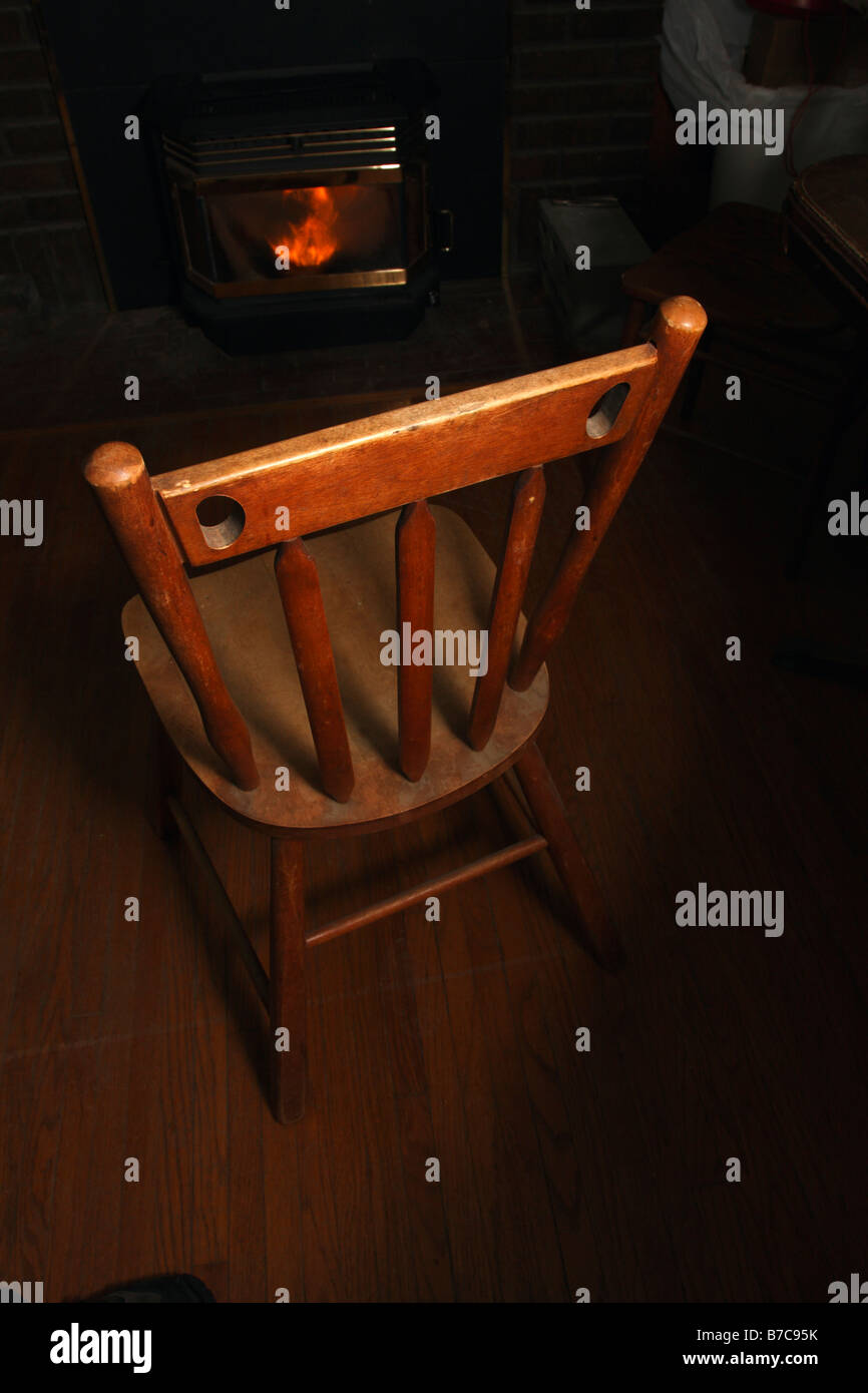 Wooden chair near fireplace Stock Photo Alamy