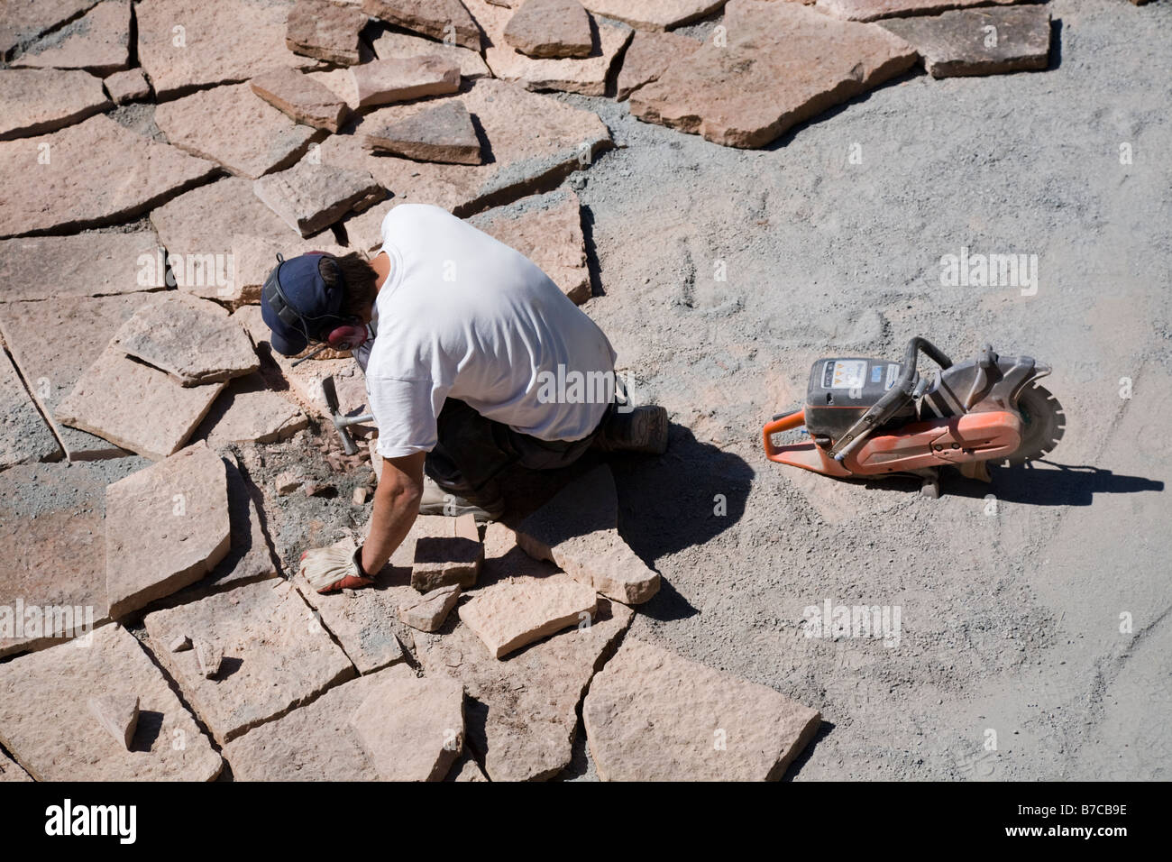 Man laying limestone slabs on a terrace Stock Photo Alamy