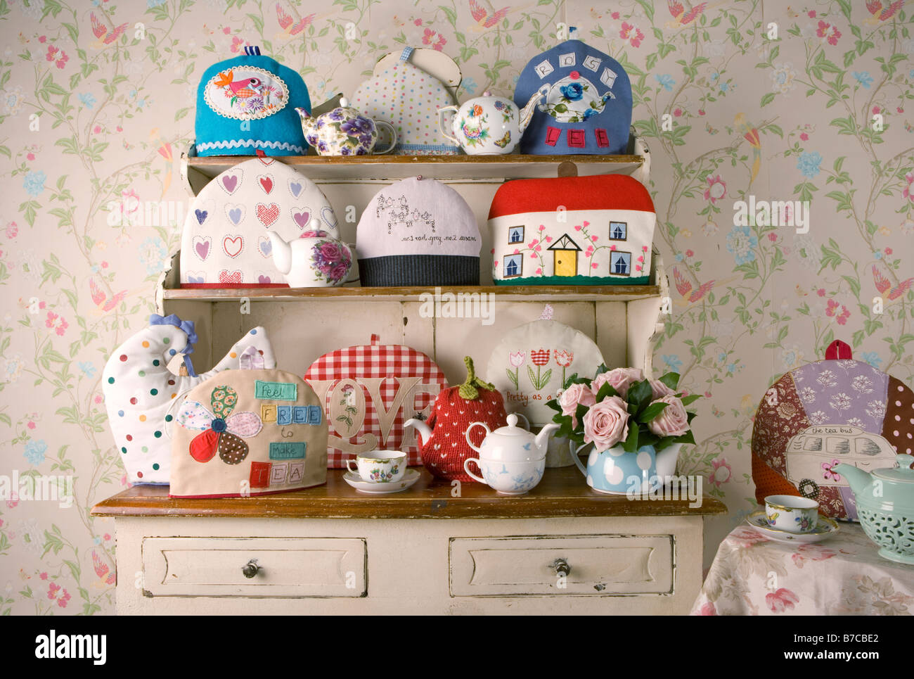 A collection of Tea Cosies on a Welsh Dresser Stock Photo