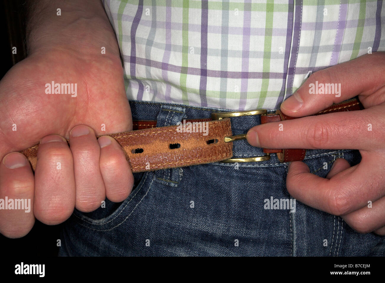 Tighten Belt Stock Photos & Tighten Belt Stock Images - Alamy
