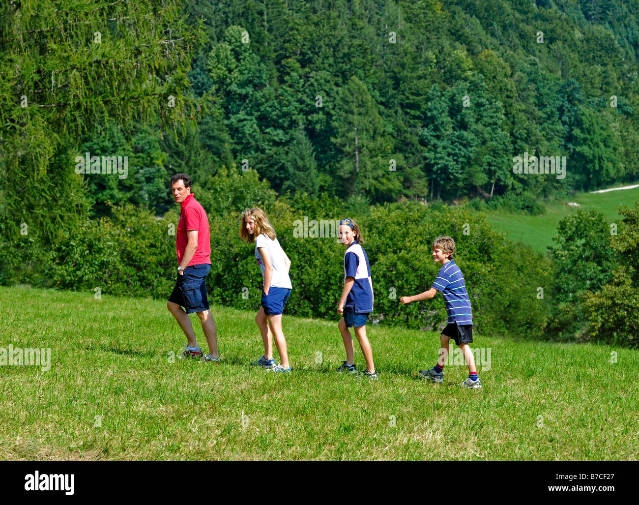 family walking in the hills Stock Photo