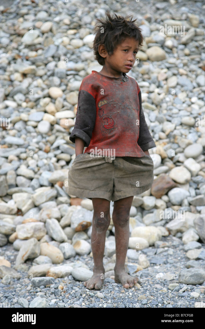 “Small nepali boy wearing filthy clothes” Stock Photo