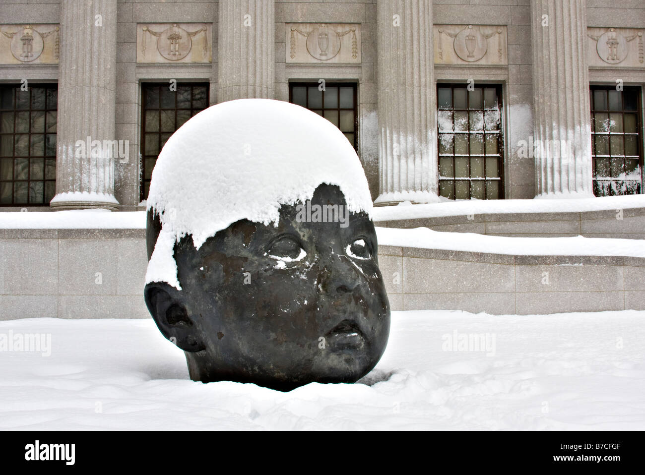 Sculpture called "Day" by Antonio Lopez Garcia covered in snow outside