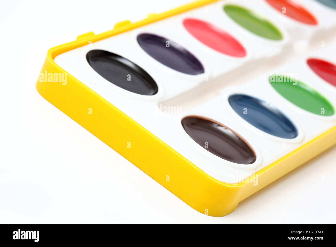 artistic palette variation of watercolors in yellow case detail Stock Photo
