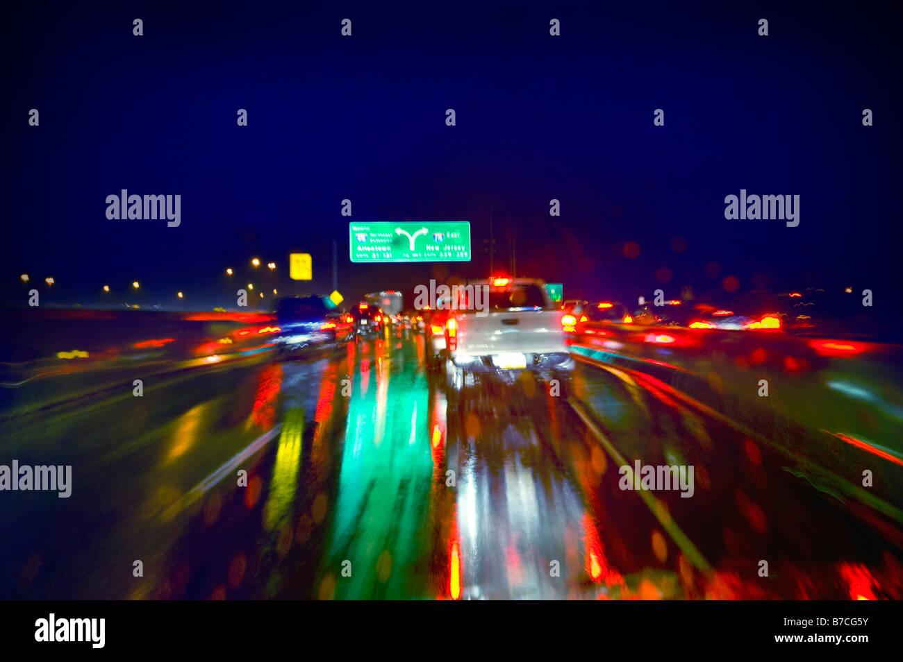 Cars On Highway At Night During Rain Storm, USA Stock Photo