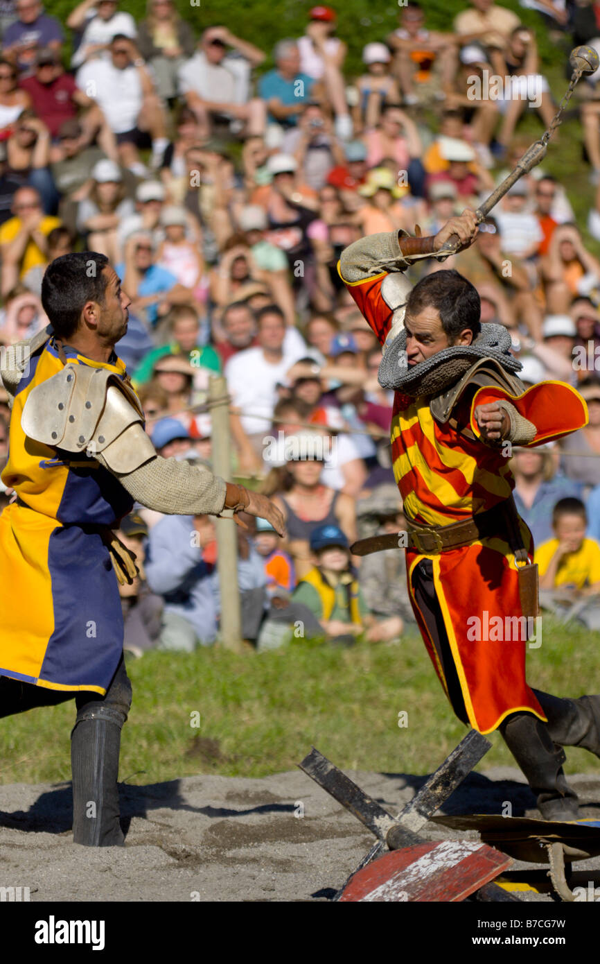 Knights dueling with maces at a French mediaeval fayre Stock Photo