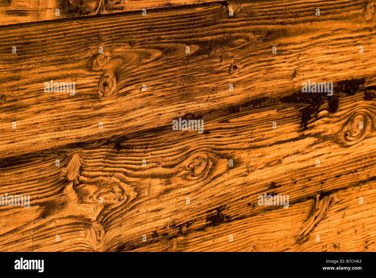 Close-up of a wooden retaining wall holding up a bank. Stock Photo