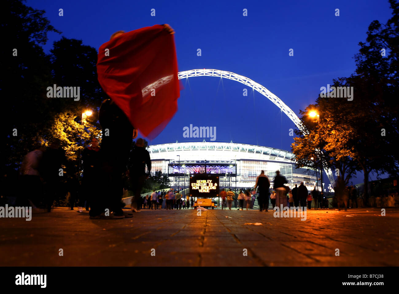 Football supporters arrive at Wembley Stadium before an FA Cup match Stock Photo
