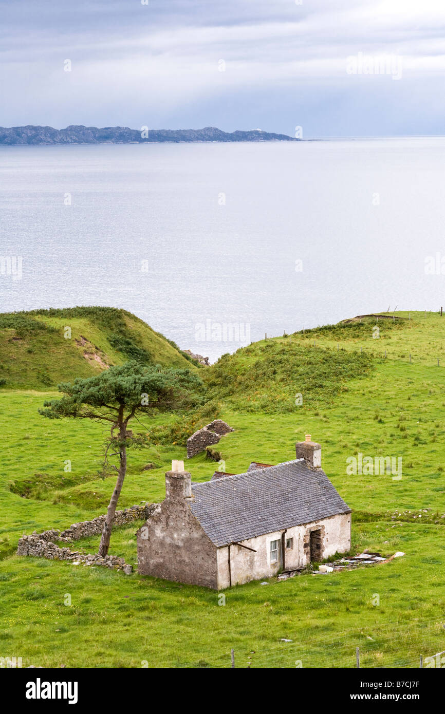 A ruined cottage on the banks of Inner Sound looking across to Rona, near Lonbain, Wester Ross, Highland, Scotland UK Stock Photo