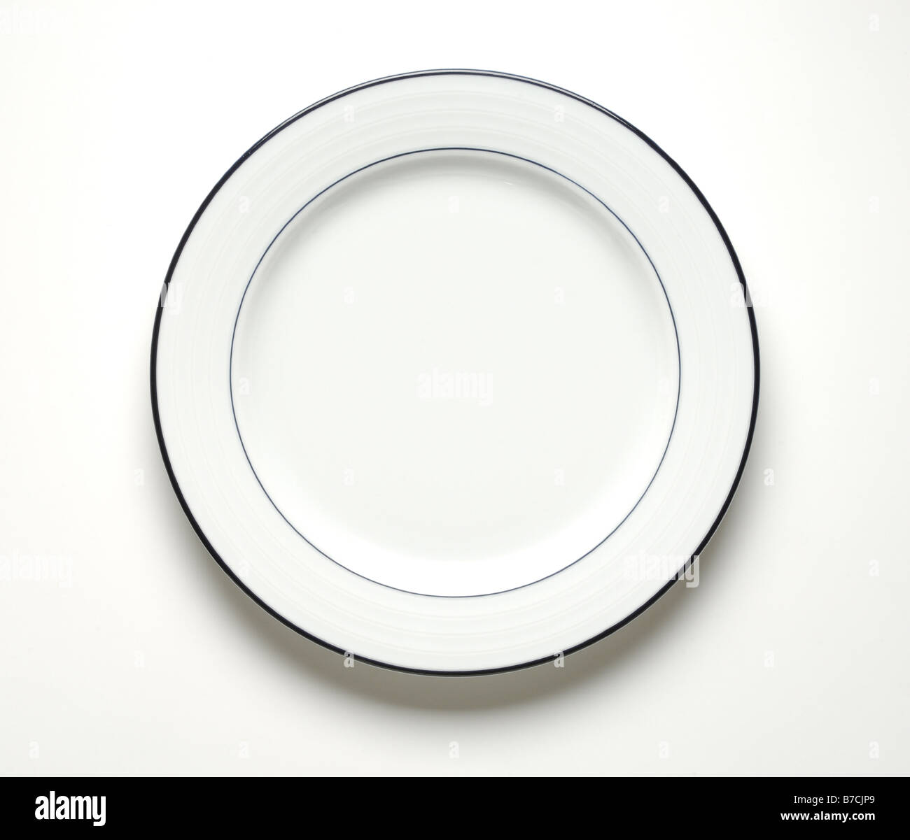 An empty round white dinner plate Stock Photo